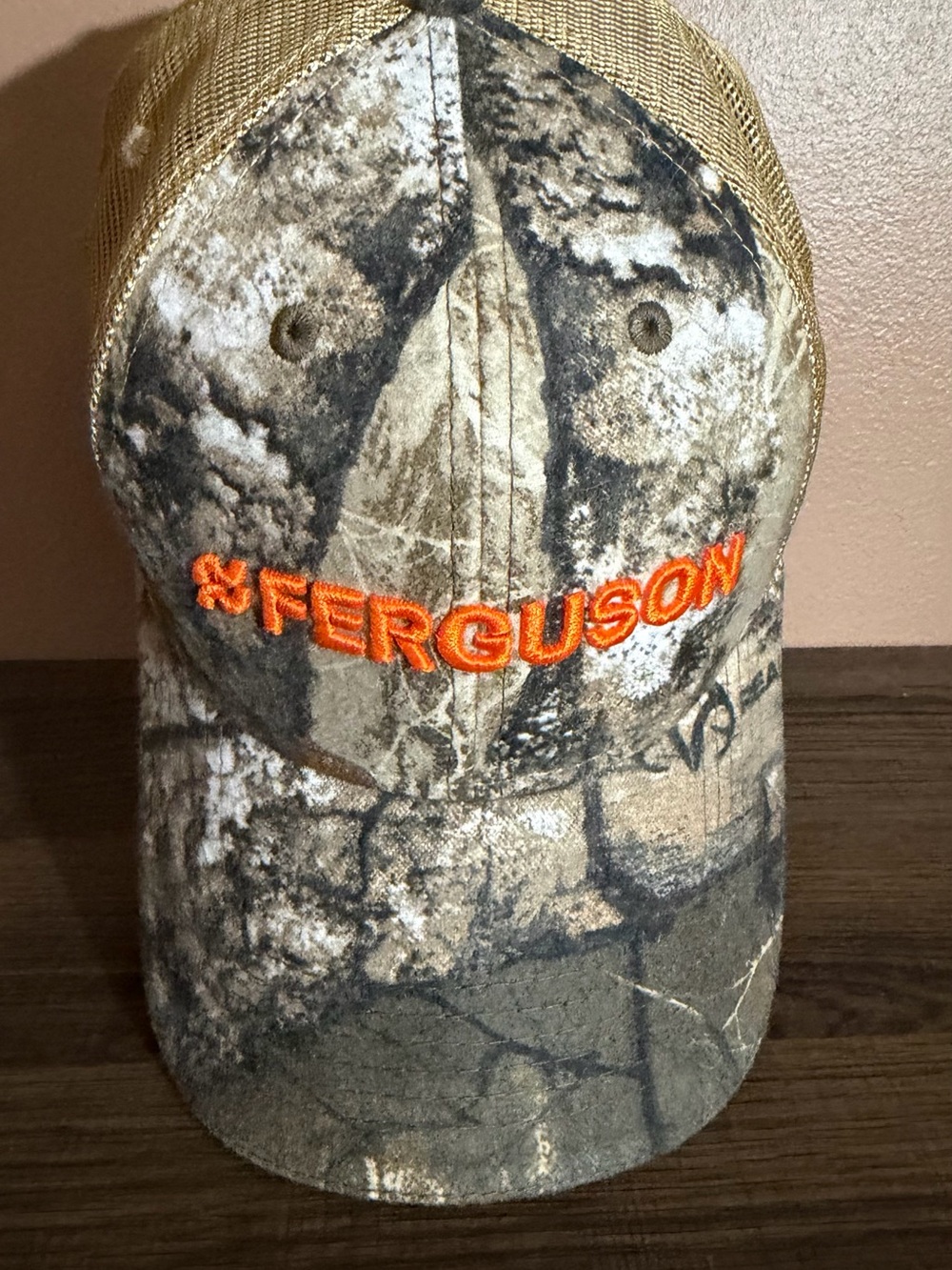 Men's Camouflage Trucker Cap with Orange Logo